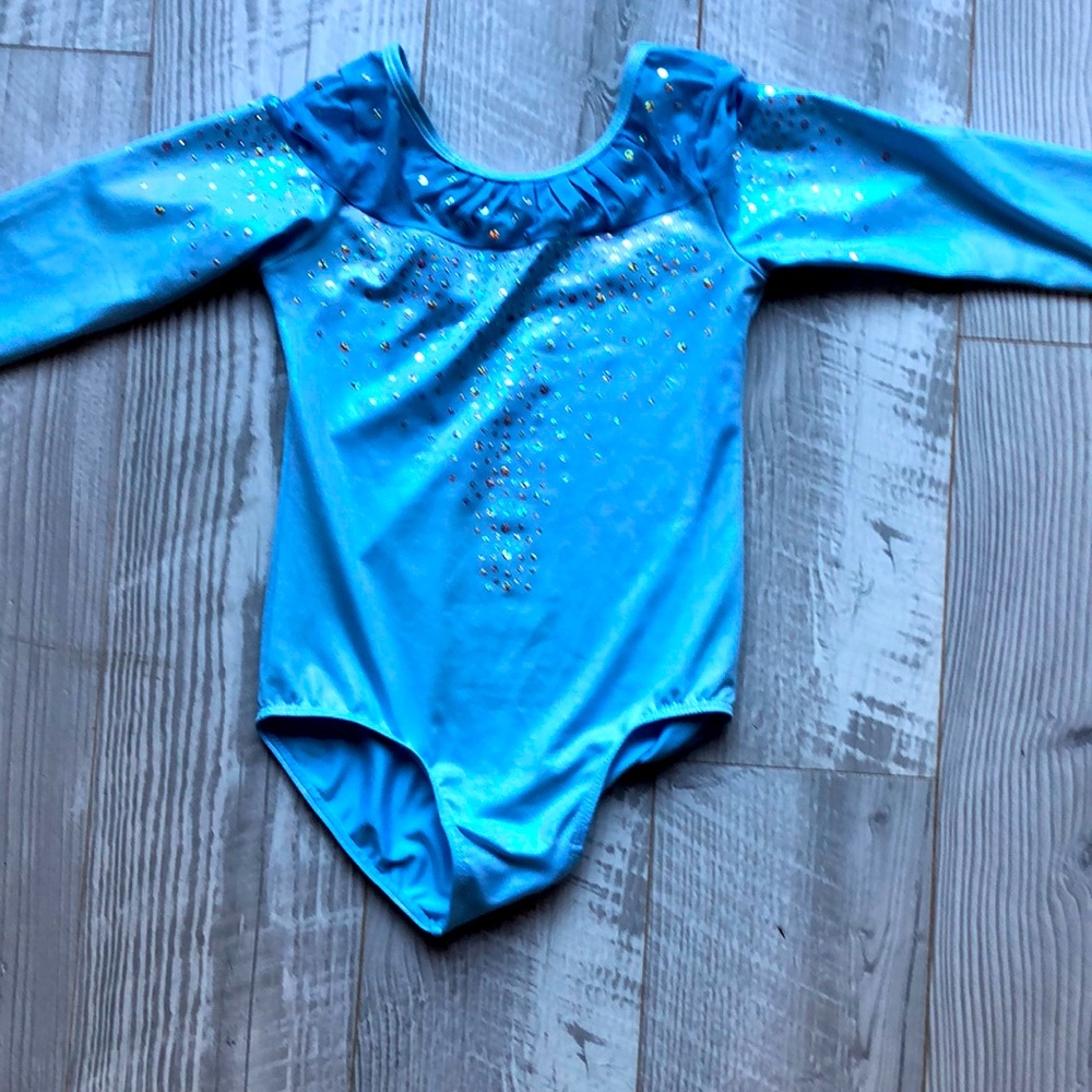 A blue tumbling outfit or dancing with sequins